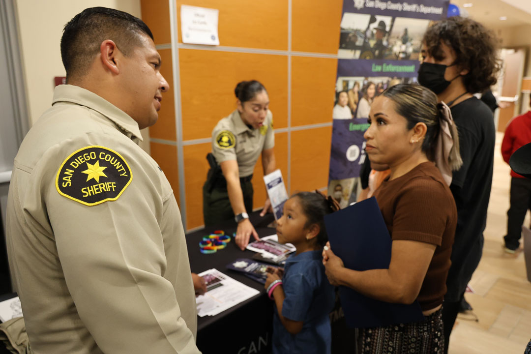 Deputy talking to a spanish academy student.