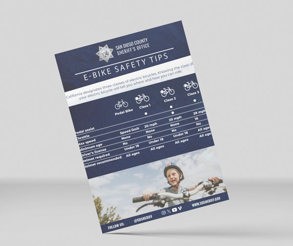 Flyer with sheriff star and boy riding a bike smiling with bike class chart.