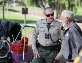 Homeless Outreach Deputy Talking to Community Member