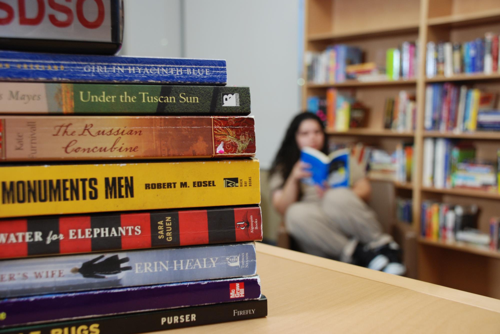 Woman reading in library at Las Colinas