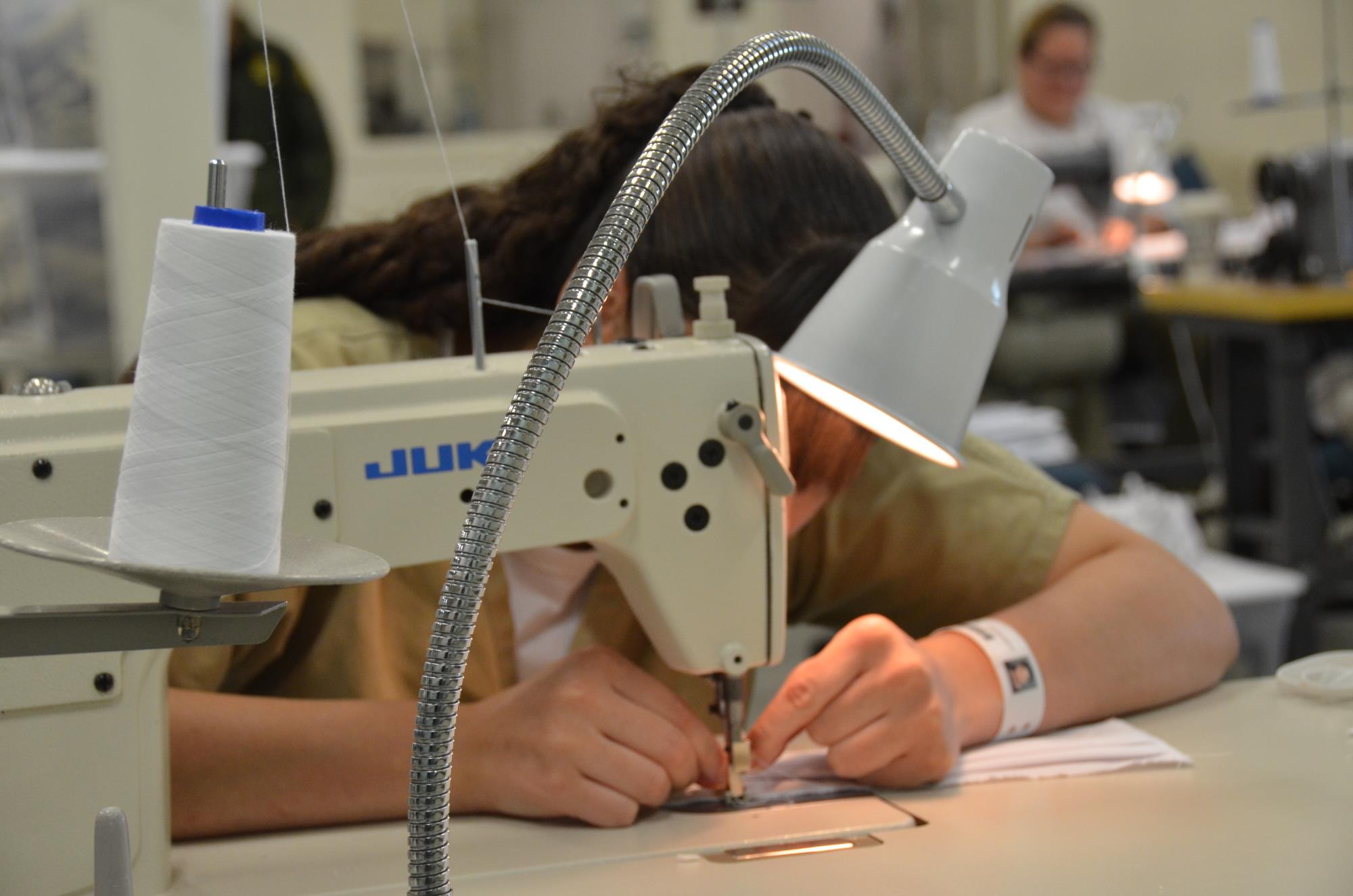 Woman sewing a mask