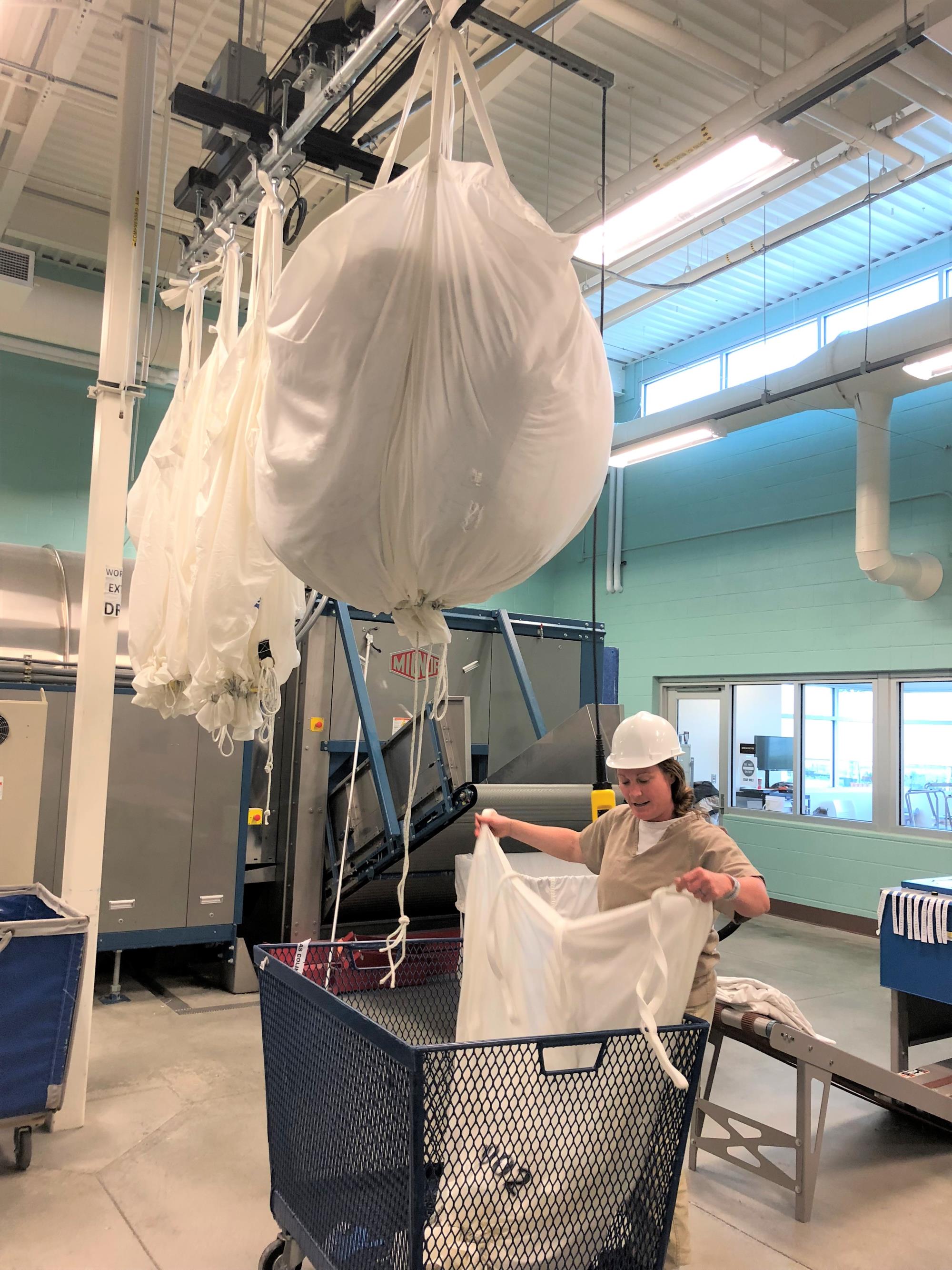 Reentry student working in industry laundry area