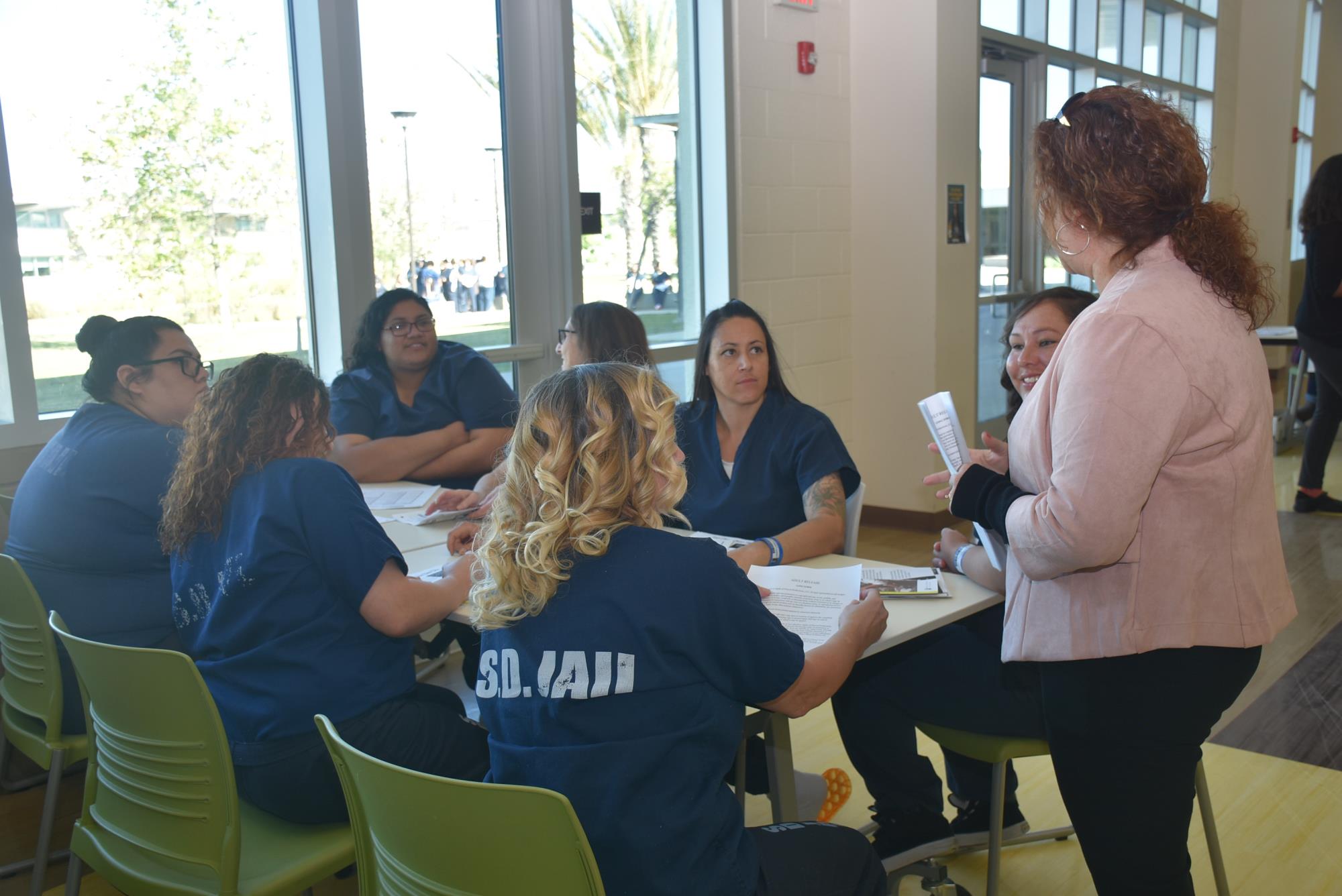 Student in a group listening to the instructor